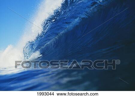 Picture - Hawaii, Long Tube Of Big Blue Wave Curling With Mist Blowing Off Tip.. Fotosearch