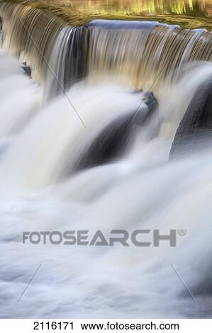 Stock Image - Hawaii, Maui, A lush waterfall among bamboo.. Fotosearch