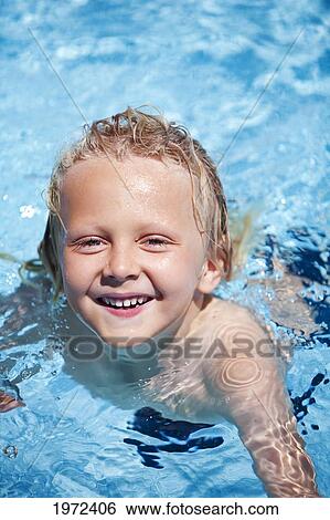 Hawaii, Maui, A Portrait Of A Young Blonde Boy Swimming In An Outdoor Pool. View Large Photo Image Stock Photograph - Hawaii, Maui, A Portrait Of A Young Blonde Boy Swimming In An Outdoor Pool.. Fotosearch