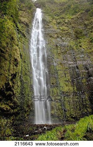 Stock Image - Hawaii, Maui, A waterfall in Kipahulu with lush foliage.. Fotosearch