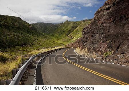 Hawaii, Maui, A winding road through Maui's west side with lush mountains. View Large Photo Image Stock Image - Hawaii, Maui, A winding road through Maui's west side with lush mountains.. Fotosearch