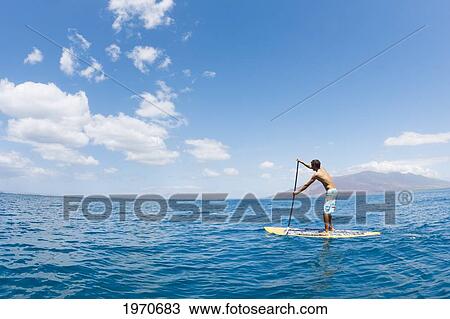 Hawaii, Maui, Athletic Young Man On A Stand Up Paddle Board View Large Photo Image Stock Image - Hawaii, Maui, Athletic Young Man On A Stand Up Paddle Board. Fotosearch