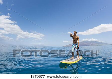 Hawaii, Maui, Athletic Young Man On A Stand Up Paddle Board View Large Photo Image Stock Photo - Hawaii, Maui, Athletic Young Man On A Stand Up Paddle Board. Fotosearch
