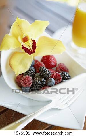 Stock Photography - Hawaii, Maui, Balcony, Breakfast Fresh Fruit Bowl With Orchid Garnish.. Fotosearch