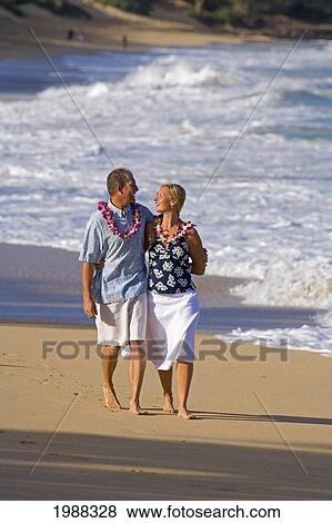 Hawaii, Maui, Baldwin Beach, Couple On Vacation Walking Down The Beach Holding Hands View Large Photo Image Stock Photo - Hawaii, Maui, Baldwin Beach, Couple On Vacation Walking Down The Beach Holding Hands. Fotosearch