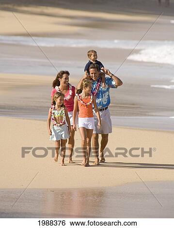 Stock Photograph - Hawaii, Maui, Baldwin Beach, Family On Vacation Walking Down The Beach.. Fotosearch