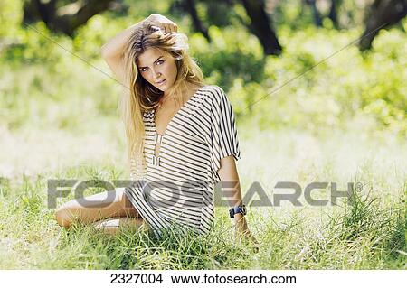 Picture - Hawaii, Maui, Beautiful Young Woman Posing In A Grassy Feild.. Fotosearch