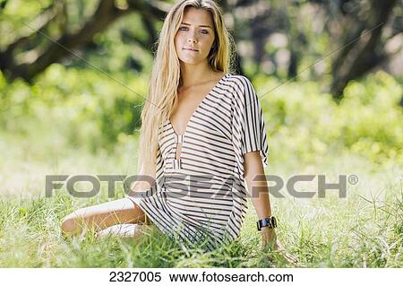 Stock Photography - Hawaii, Maui, Beautiful Young Woman Posing In A Grassy Feild.. Fotosearch
