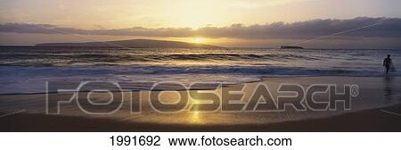 Stock Image - Hawaii, Maui, Big Beach At Sunset With Reflections In Sand, Kahoolawe And Molokini In Background, Panoramic. Fotosearch