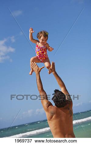 Stock Photo - Hawaii, Maui, Father And Daughter Enjoying A Day On The Beach.. Fotosearch