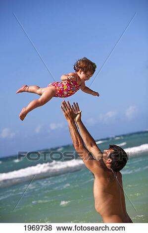 Stock Photo - Hawaii, Maui, Father And Daughter Enjoying A Day On The Beach.. Fotosearch