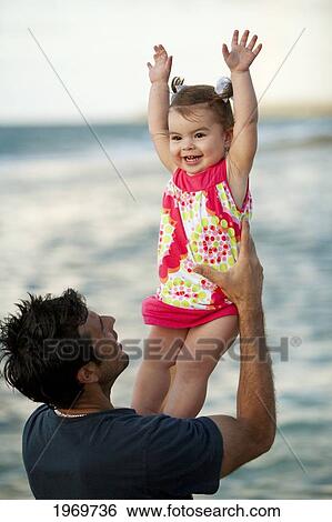 Stock Photograph - Hawaii, Maui, Father And Daughter Enjoying A Day On The Beach.. Fotosearch