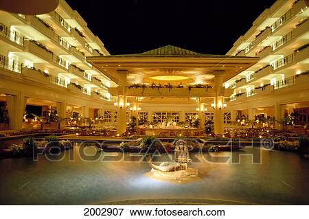 Stock Photo - Hawaii, Maui, Grand Wailea Resort Inner Courtyard Illuminated At Twilight, Mermaid In Water Fountain, Statue. Fotosearch