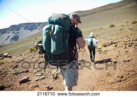 Hawaii, Maui, Haleakala Crater, A couple hiking the craters floor. View Large Photo Image Stock Image - Hawaii, Maui, Haleakala Crater, A couple hiking the craters floor.. Fotosearch