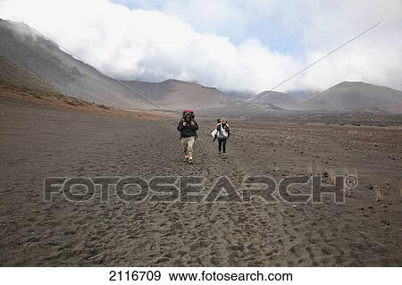 Hawaii, Maui, Haleakala Crater, A couple hiking the craters floor. View Large Photo Image Stock Photo - Hawaii, Maui, Haleakala Crater, A couple hiking the craters floor.. Fotosearch