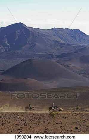 Picture - Hawaii, Maui, Haleakala Crater, Horseback Riders Crossing The Crater Floor. Fotosearch