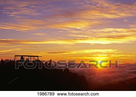 Hawaii, Maui, Haleakala Crater, Visitors Enjoy A Colorful Sunrise. View Large Photo Image Stock Photo - Hawaii, Maui, Haleakala Crater, Visitors Enjoy A Colorful Sunrise.. Fotosearch