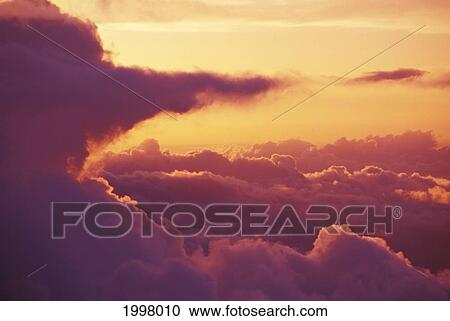 Hawaii, Maui, Haleakala, Light Orange Sky With Pink Afternoon Cloud Formations View Large Photo Image Stock Image - Hawaii, Maui, Haleakala, Light Orange Sky With Pink Afternoon Cloud Formations. Fotosearch