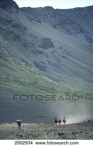 Picture - Hawaii, Maui, Haleakala National Park, Horseback Riders In Distance And Hiker Along Crater Floor. Fotosearch
