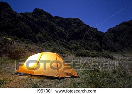 Stock Image - Hawaii, Maui, Haleakala National Park, Glowing Tent At Paliku Cabin At Night, Long Exposure. Fotosearch