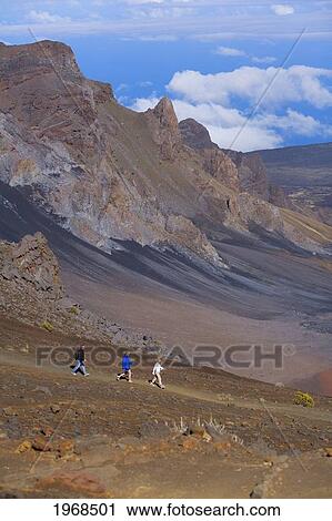 Hawaii, Maui, Haleakala National Park, Three Hikers Walking A Path. View Large Photo Image Stock Image - Hawaii, Maui, Haleakala National Park, Three Hikers Walking A Path.. Fotosearch