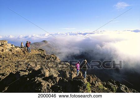 Hawaii, Maui, Haleakala National Park, Visitors Stand On Cliffs, Look Into Crater View Large Photo Image Stock Photograph - Hawaii, Maui, Haleakala National Park, Visitors Stand On Cliffs, Look Into Crater. Fotosearch