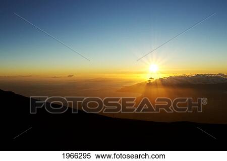 Stock Photography - Hawaii, Maui, Haleakala National Park, View Of Sunset Over Southwestern Coastline From Crater Summit.. Fotosearch