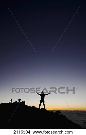 Hawaii, Maui, Haleakala, The silouhette of a man posing on summit at sunset. View Large Photo Image Picture - Hawaii, Maui, Haleakala, The silouhette of a man posing on summit at sunset.. Fotosearch