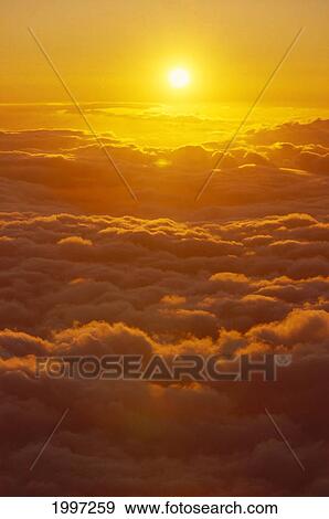 Hawaii, Maui, Haleakala, Tropical Sunset From Above Clouds, Scenic A46G View Large Photo Image Stock Photo - Hawaii, Maui, Haleakala, Tropical Sunset From Above Clouds, Scenic A46G. Fotosearch