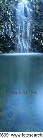 Stock Photo - Hawaii, Maui, Hana, Cascading Waterfall Into Pool With Reflections, Blurred Panoramic C1642. Fotosearch