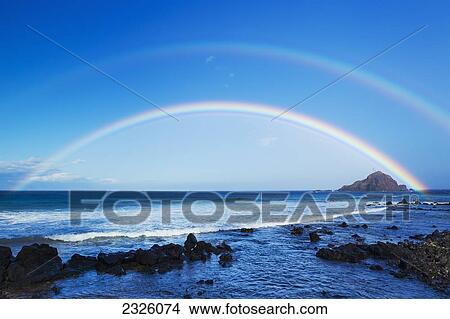 Picture - Hawaii, Maui, Hana, Dramatic Coastline, Rainbow Over Ocean.. Fotosearch