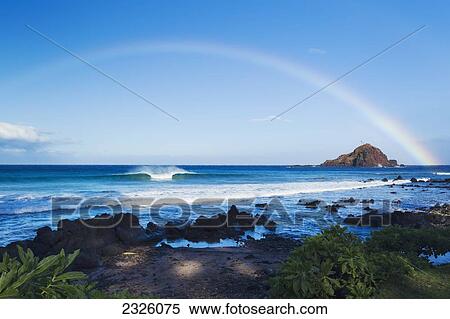 Stock Photography - Hawaii, Maui, Hana, Dramatic Coastline, Rainbow Over Ocean.. Fotosearch