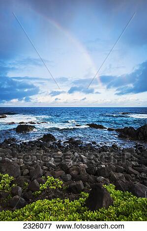 Stock Photo - Hawaii, Maui, Hana, Dramatic Stormy Sunrise Over Coastline, Rainbow Over Ocean.. Fotosearch