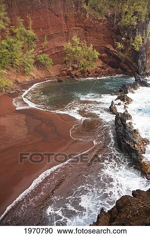 Stock Image - Hawaii, Maui, Hana, Kaihalulu Beach, Scenic Shot Of Hana's Red Sand Beach.. Fotosearch