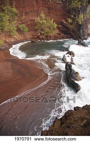 Stock Image - Hawaii, Maui, Hana, Kaihalulu Beach, Scenic Shot Of Hana's Red Sand Beach.. Fotosearch