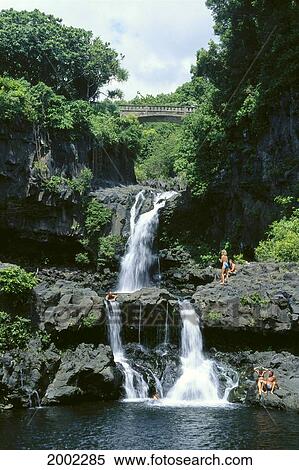 Stock Photography - Hawaii, Maui, Hana, Kipahulu, Seven Sacred Pools 'ohe O Gulch, Visitors Sunbathe And Swim. Fotosearch