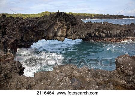 Picture - Hawaii, Maui, Hana, Lava rock formation arches over ocean.. Fotosearch