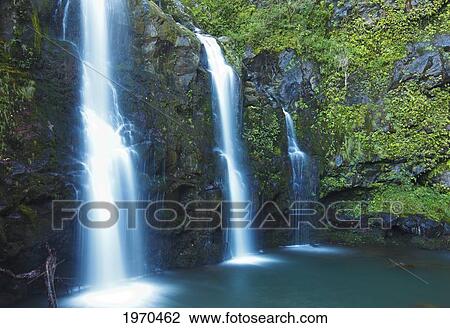 Stock Image - Hawaii, Maui, Hana, Lush Waterfalls Alongside The Road To Hana. Fotosearch