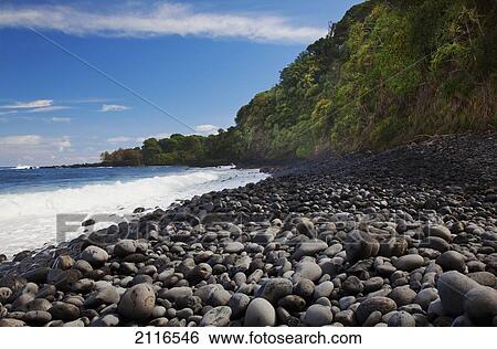 Stock Photograph - Hawaii, Maui, Hana, The coast of Nahiku from a rocky beach.. Fotosearch