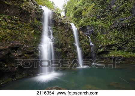 Picture - Hawaii, Maui, Hana, The three Waikani Falls with a clear blue pond on The Road To Hana. Fotosearch