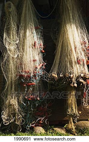 Stock Image - Hawaii, Maui, Hana Town, Fishing Nets Hanging On A Wall.. Fotosearch