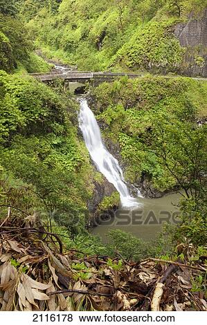 Stock Photo - Hawaii, Maui, Hana, Wailua Falls beaneath a bridge along the road to Hana.. Fotosearch