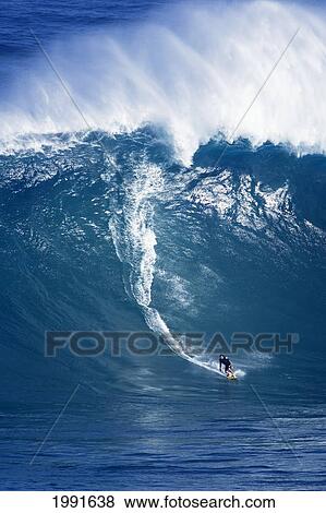 Stock Photo - Hawaii, Maui, Haroldo Ambr=Sio Surfs Huge Wave At Jaws Aka Peahi.. Fotosearch