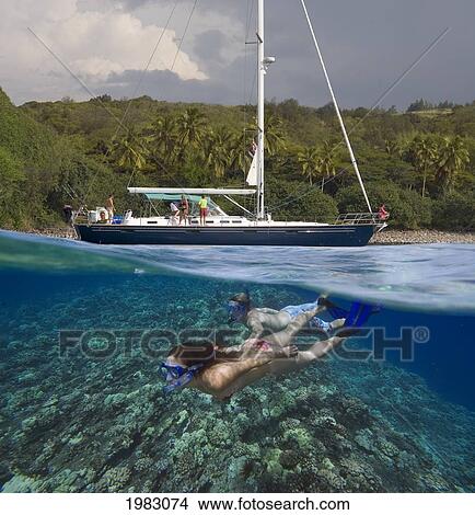 Picture - Hawaii, Maui, Honolua Bay, Snorkelers Underwater And Sailboat Above.. Fotosearch