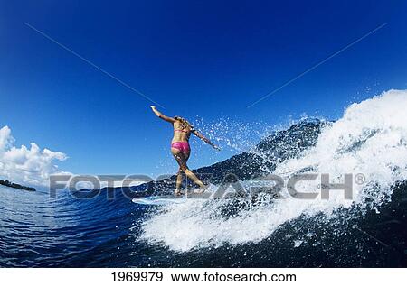 Stock Photo - Hawaii, Maui, Hookipa, Kelly Potts Riding A Wave.. Fotosearch