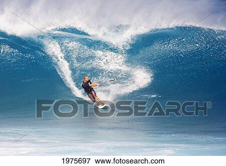 Stock Photo - Hawaii, Maui, Ho'okipa, Man Kitesurfing On Large Blue Wave.. Fotosearch