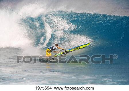 Picture - Hawaii, Maui, Ho'okipa, Man Windsurfing On Large Blue Wave.. Fotosearch