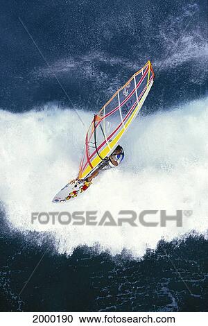 Hawaii, Maui, Ho'okipa, Overview Of Windsurfer Riding Wave Whitewash. For Editorial Use Only. View Large Photo Image Stock Image - Hawaii, Maui, Ho'okipa, Overview Of Windsurfer Riding Wave Whitewash. For Editorial Use Only.. Fotosearch