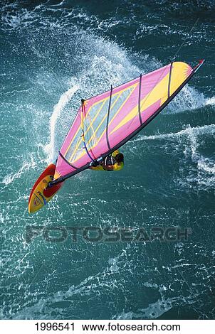 Stock Image - Hawaii, Maui, Ho'okipa, Pete Cabrinha Windsurfs, Aerial Shot. Fotosearch