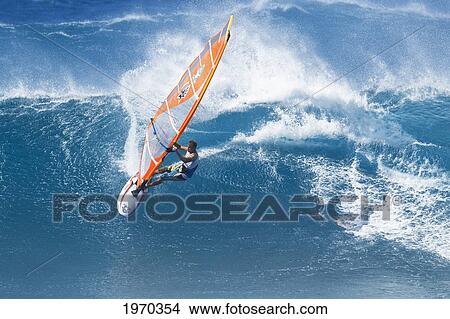 Picture - Hawaii, Maui, Ho'okipa, Professional Windsurfer Kevin Pritchard Carves Powerful Turn On Wave. For Editorial Use Only.. Fotosearch